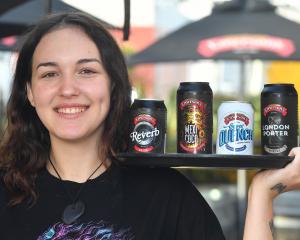 Emerson’s Brewery employee Myah Darning with the brewery’s four award-winning beers. PHOTO:...
