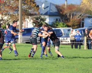 Wyndham prop Brad Shaw powers through an Edendale pincer tackle during the teams’ match — Shaw’s...