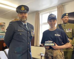 Royal New Zealand Air Force Squadron Leader Craig Thornley with excellence award winner Gabriella...