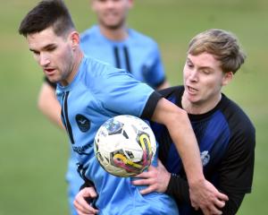 Dunedin City Royals player Raven August (left) contests for the ball against Selwyn United’s Luke...