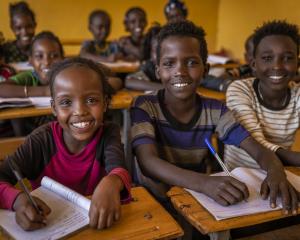 Children enthusiastically wait for school to start in their isolated village in southern Ethiopia...