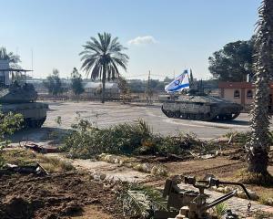 Israeli tanks at the border crossing between Gaza and Egypt in Rafah. Photo:  ISRAEL DEFENSE...
