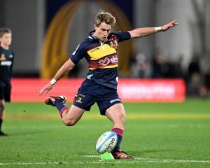 Highlanders first five Cameron Millar kicks another goal in the Super Rugby Pacific game against...