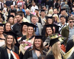 A previous University of Otago graduation parade makes its way along George St. PHOTO: PETER...