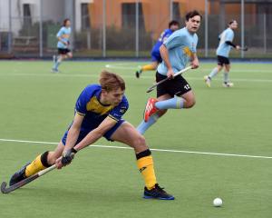 Baxter Meder looks to pass the ball during the Taieri Tuataras’ match against University Whales...