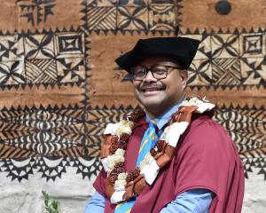 University of Otago graduand Jekope Maiono celebrates the completion of his PhD at the Pacific...