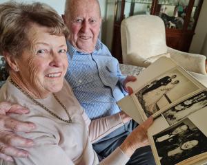 Wānaka retirees Eleanor, 85, and John, 86, Lischner look through photographs from their wedding...