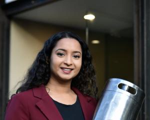 Spout Milk co-founder Jo Mohan with a keg used at Dunedin’s Catalyst cafe. PHOTO: PETER MCINTOSH