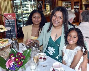 Kara Tanimatuku and her daughters Lucy (left), 12, and Ako Navara, 7, enjoy Mother’s Day high tea...