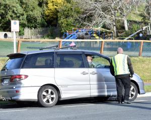 A council parking officer talks to&nbsp; a driver parked in Longworth St, North East Valley,&nbsp...