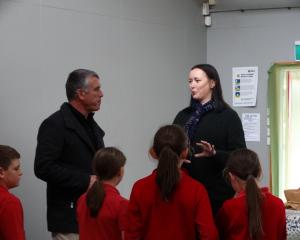 Palmerston School teacher aide Sarah Jane Kelly shows Waitaki MP Miles Anderson around the school...