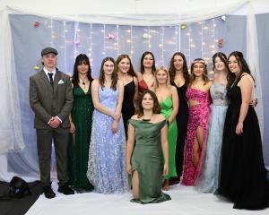 Enjoying the school formal are (from left, back row) 17-year olds William Clare, Maia Perry,...