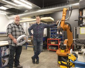 Inventors’ Lab Manager Ivan Mason (left) and Petridish co-founder Jason Lindsey stand amid drills...