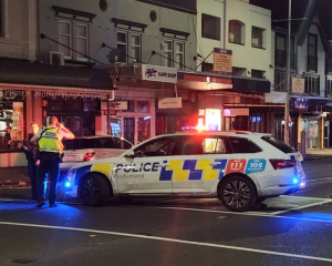 Police at the scene of a cordon after a reported death on Ponsonby Rd. Photo: RNZ