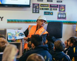 Roading project The Alliance communications manager Alan Howard-Smith reads to pupils at...
