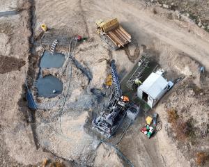 An aerial view of a drilling rig at the Rise and Shine deposit, atop the Rise and Shine ridge,...