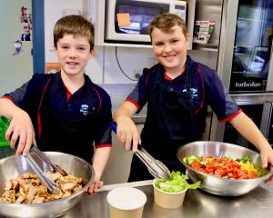 Jack Adam and Harry Tapp, both aged 10, help prepare lunches at Silverstream School. PHOTO: SIMON...