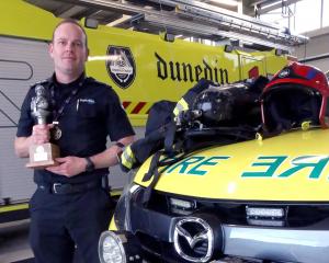 Dunedin Airport Emergency Services blue watch chief Clint Hagan shows his kit, weighing about...