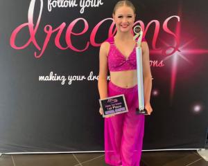 Emily Brown, 13, was crowned a triple national champion in the 12/13 division.