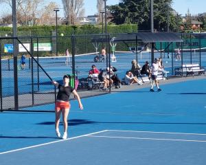 Charlie Byers, 18, prepares to serve in the women’s doubles A-grade final. PHOTOS: SUPPLIED