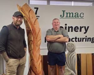 Sculptor Steve Molloy (left) and Jmac Joinery owner John McCarthy show off sculptures that will...