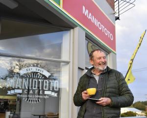 Richard Bowman, of Lake Hayes, enjoys a cuppa outside the Maniototo Cafe in Ranfurly. Photo:...