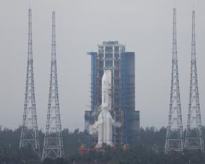 The Chang'e 6 lunar probe and the Long March-5 Y8 carrier rocket combination sit atop the launch...