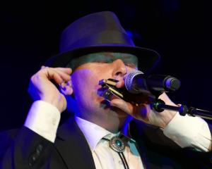 Gore instrumentalist Brendon Fairbairn gees up the crowd with his harmonica during the MLT Gold...