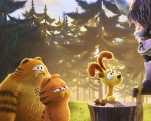 From left, Vic (voiced by Samuel L. Jackson), Garfield (Chris Pratt), Odie (Harvey Guillén) and...
