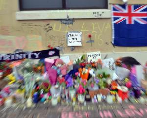 A small sign amidst the memorial messages and flowers at the bus hub, in memory of Enere McLaren...