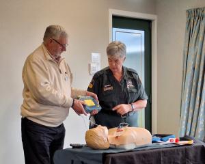Under the watchful eye of Teressa May from Hato Hone St John, Cancer Society volunteer Mark...