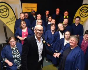 Cargill Enterprises chief executive Geoff Kemp congratulates Deborah Riley and other graduates at...