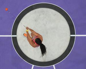 Camryn Rogers, of Canada, in action during the Paris Olympics women’s hammer throw final at Stade...