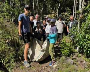 Rotary Club and OU Medical Students Association members collecting leaf litter for the new aviary...