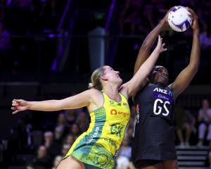 Grace Nweke of New Zealand and Courtney Bruce of Australia compete for the ball during game one...