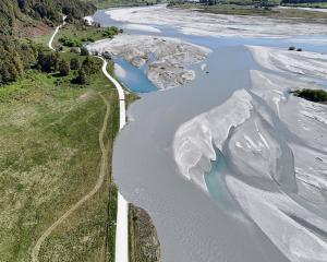 An aerial photo shows where the flooded Dart River washed away a section of Kinloch Rd. Photo:...