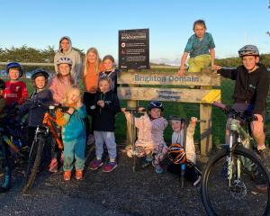 Brighton resident Shane Turner (right) and local children, eager for a local pump track, were...