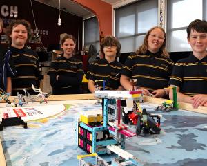 Showcasing robot building skills are Tahuna Normal Intermediate School pupils (from left)...