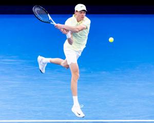 Jan Sinner plays a backhand during his win in Melbourne last night. Photo: Getty Images