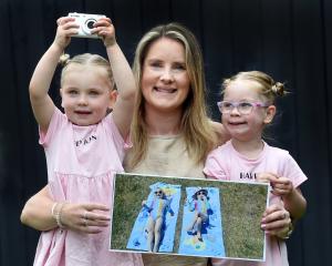 Michaela Lobb shows off her winning Otago Daily Times "Magic Moments" photograph, alongside the...
