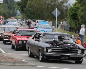 The Muscle Car Madness street parade. Photo: John Cosgrove
