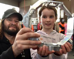 Alex Ramsay, chief technical officer of United Machinists, shows Arabella Douglas a bit of camera...