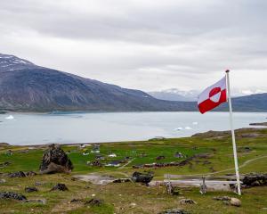 Greenland's flag flies in Igaliku settlement, Greenland. Photo: Reuters
