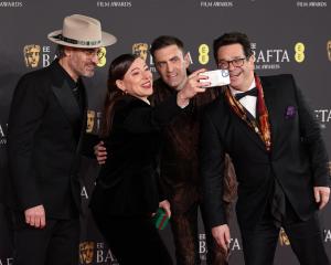 Lizzie Gillett takes a selfie with her fellow producers and co-directors (from left) Ian Bonhote,...