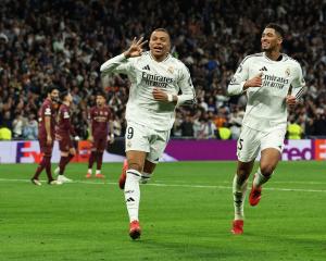 Real Madrid’s Kylian Mbappe (left) and Jude Bellingham celebrate Mbappe’s third goal against...