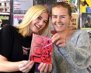 Critic Te Ārohi features editor Iris Hehir (left) and editor Nina Brown hold a mock-up of the...