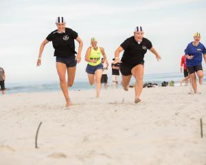 Sarah Ramsay races up Waikouaiti Beach. PHOTO: JUSTINE WEATHERALL
