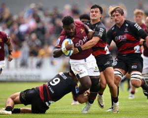 The Highlanders' Timoci Tavatavanawai tries to bust through through the Crusaders defence. Photo:...