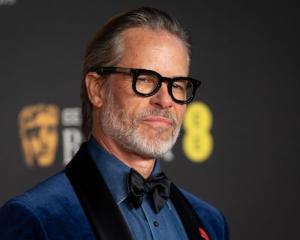 Guy Pearce, pictured at the Baftas this week, says Kevin Spacey was "handsy" when they worked...