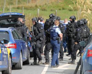 Armed police at the scene of a manhunt near Owaka in South Otago yesterday. PHOTO: NICK BROOK